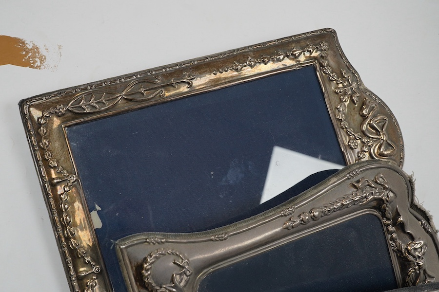 A small George V silver mounted photograph frame, 11.2cm, together with three larger modern silver mounted photograph fames and an 800 standard frame. Condition - poor to fair